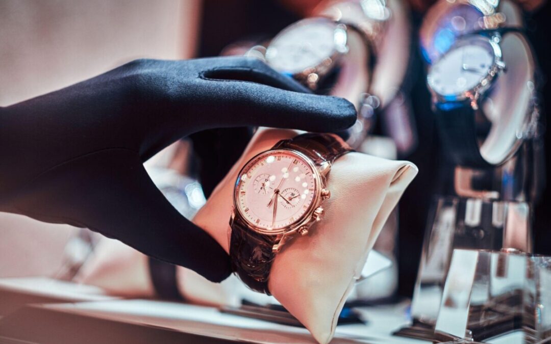 Luxury vintage watch being displayed by a seller wearing black gloves in a high-end boutique. The perfect investment piece for collectors and watch enthusiasts.